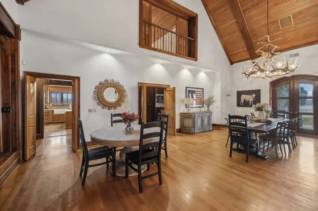 a bedroom with furniture and a chandelier