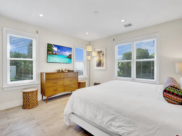 a bedroom with bed and a window