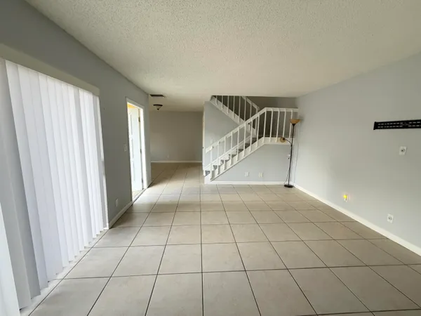 a view of an empty room and entryway