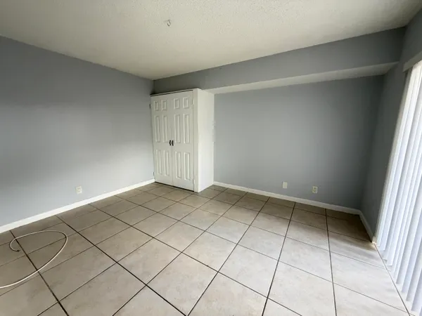 a view of an empty room and utility room