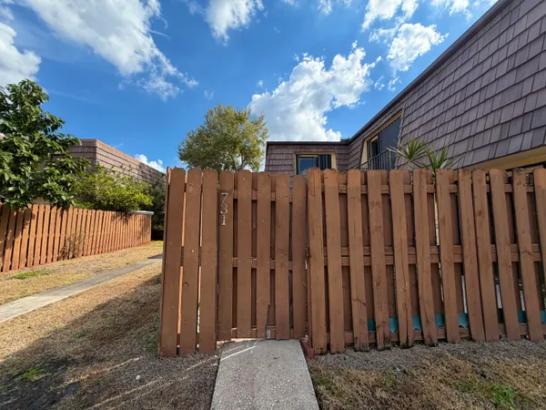 a view of outdoor space with wooden fence