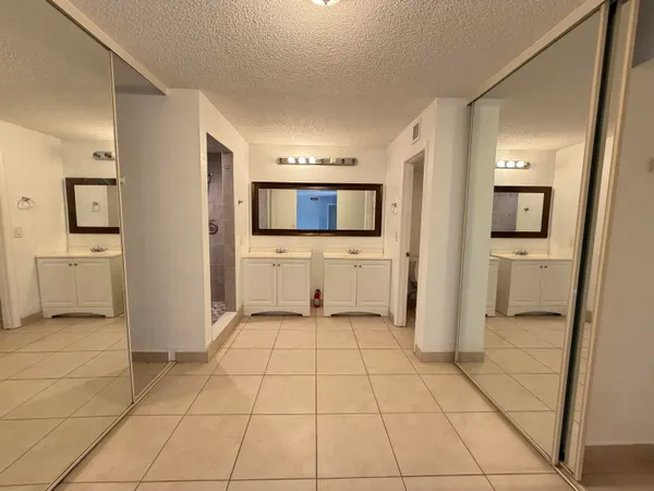 a view of a storage & utility room with two washing machine