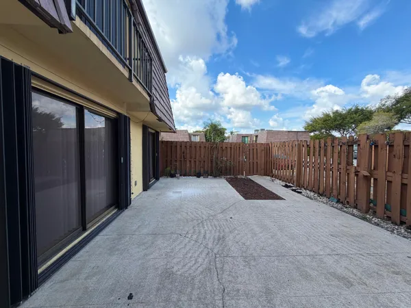 a view of balcony with wooden fence