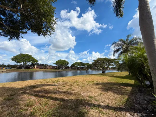 a view of a lake with houses in the back