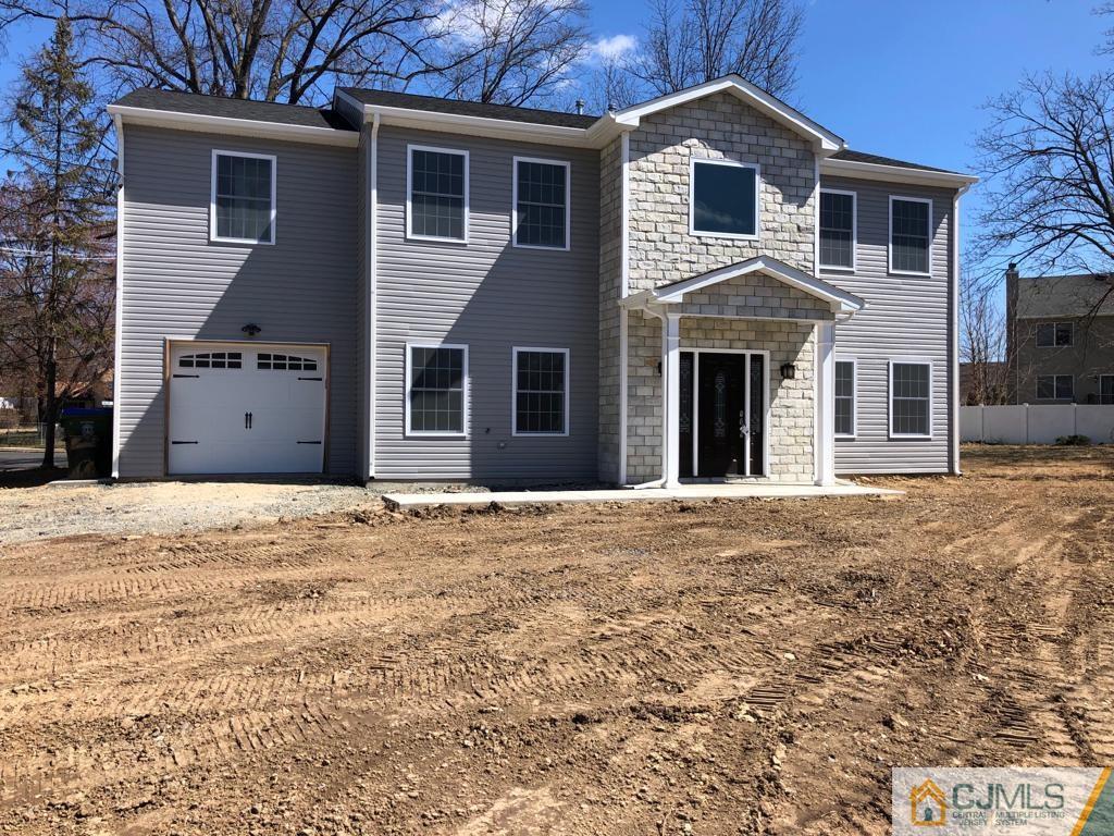 42 Crescent Road Edison, NJ 08817 - Photo 1 of 20 a front view of a house with a yard
