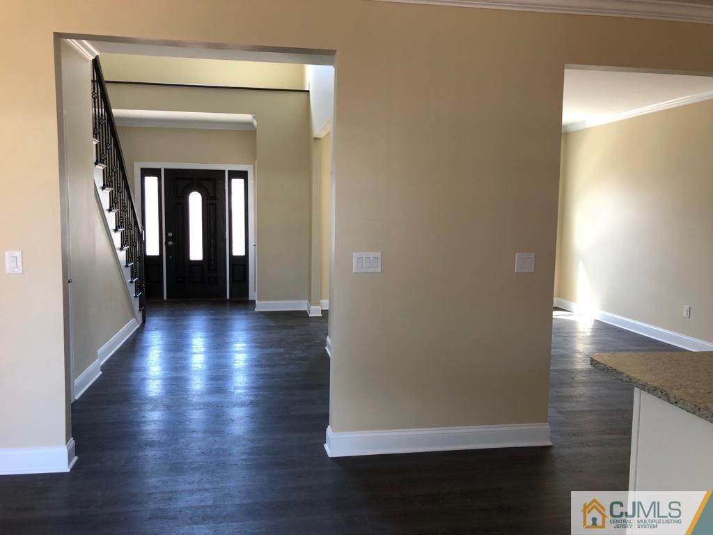 42 Crescent Road Edison, NJ 08817 - Photo 2 of 20 a view of a hallway with wooden floor