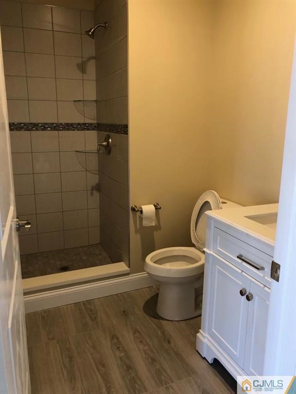 42 Crescent Road Edison, NJ 08817 - Photo 11 of 20 a bathroom with a toilet and shower