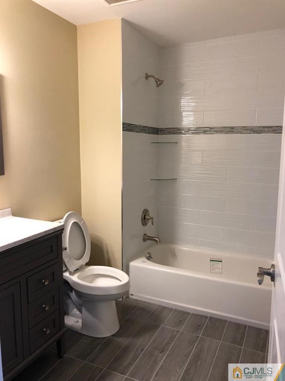 42 Crescent Road Edison, NJ 08817 - Photo 13 of 20 a bathroom with a toilet and a shower