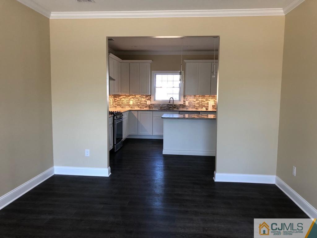 42 Crescent Road Edison, NJ 08817 - Photo 6 of 20 a view of kitchen with granite countertop cabinets and wooden floor