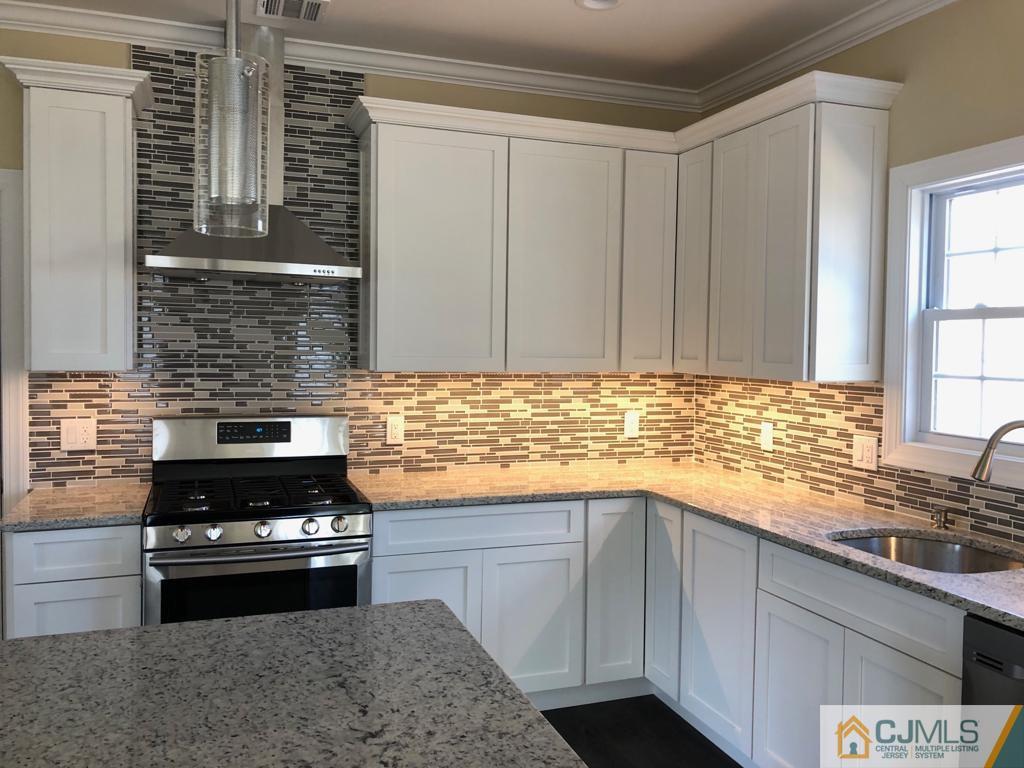 42 Crescent Road Edison, NJ 08817 - Photo 7 of 20 a kitchen with a sink and cabinets