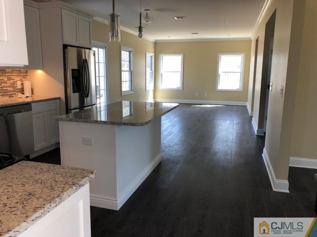 42 Crescent Road Edison, NJ 08817 - Photo 8 of 20 a view of a kitchen cabinets and a wooden floor