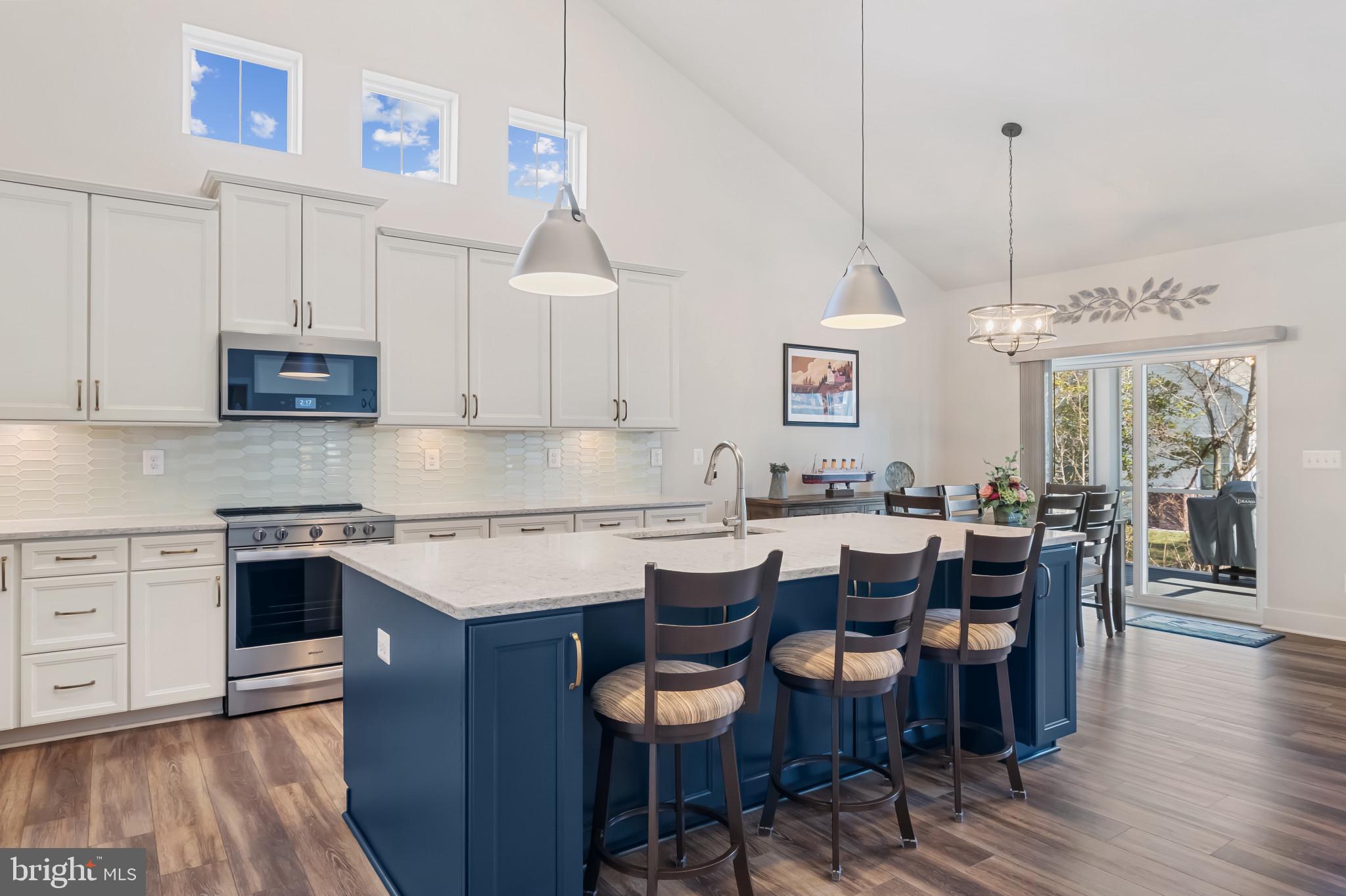 19437 Longfellow Way Georgetown, DE 19947 - Photo 20 of 33 a kitchen with lots of counter space and furniture