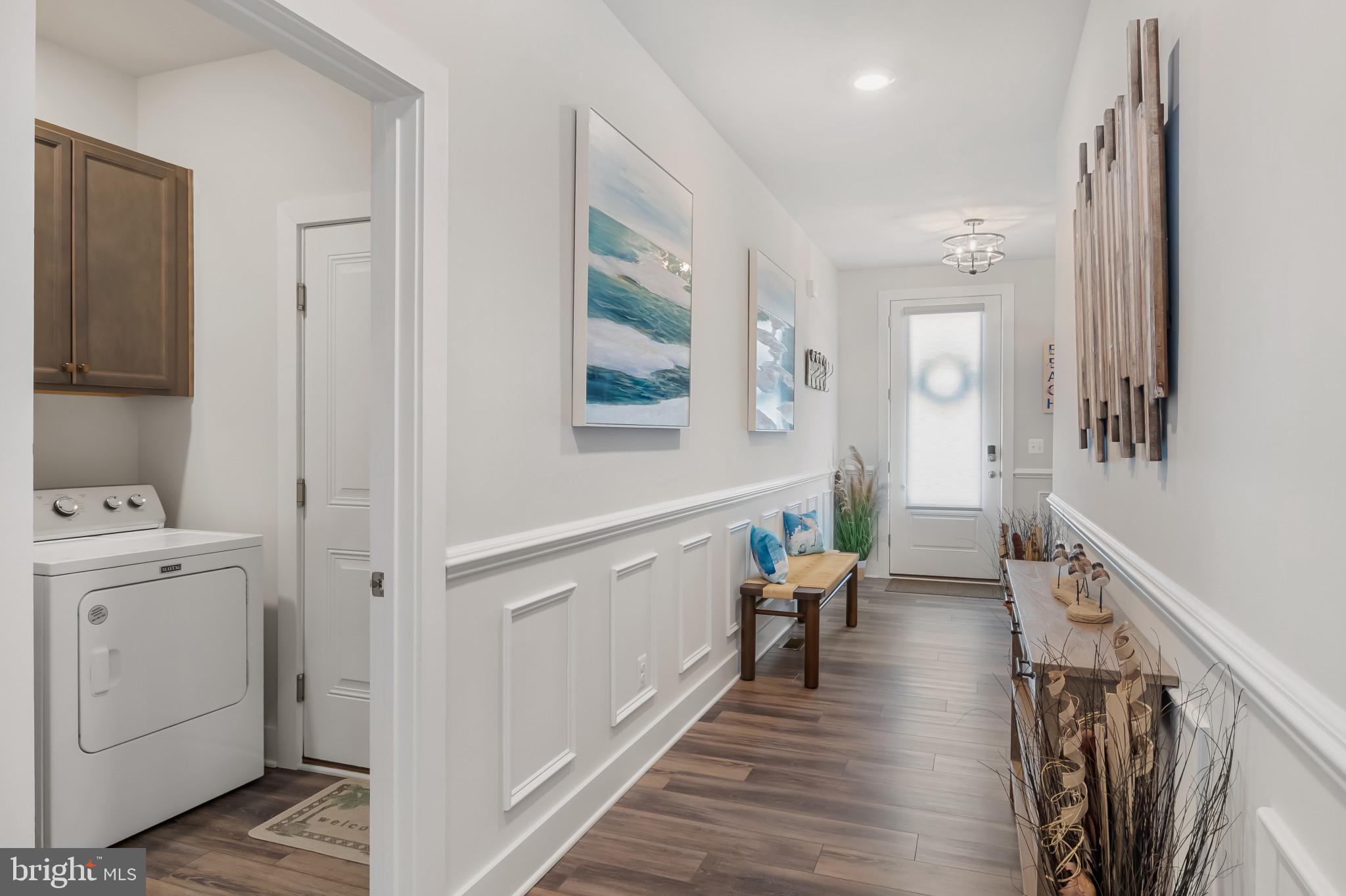 19437 Longfellow Way Georgetown, DE 19947 - Photo 2 of 33 a room with furniture and wooden floor