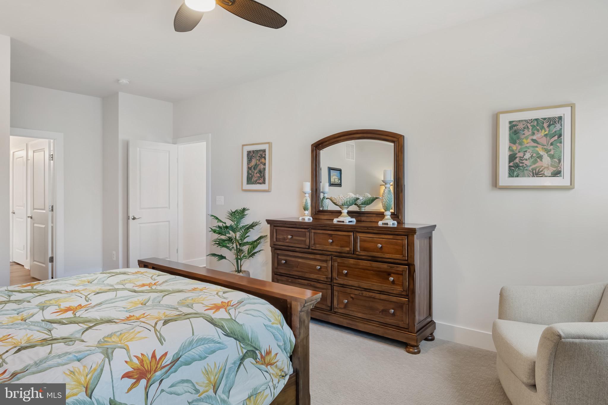 19437 Longfellow Way Georgetown, DE 19947 - Photo 26 of 33 a bedroom with a bed and a dresser