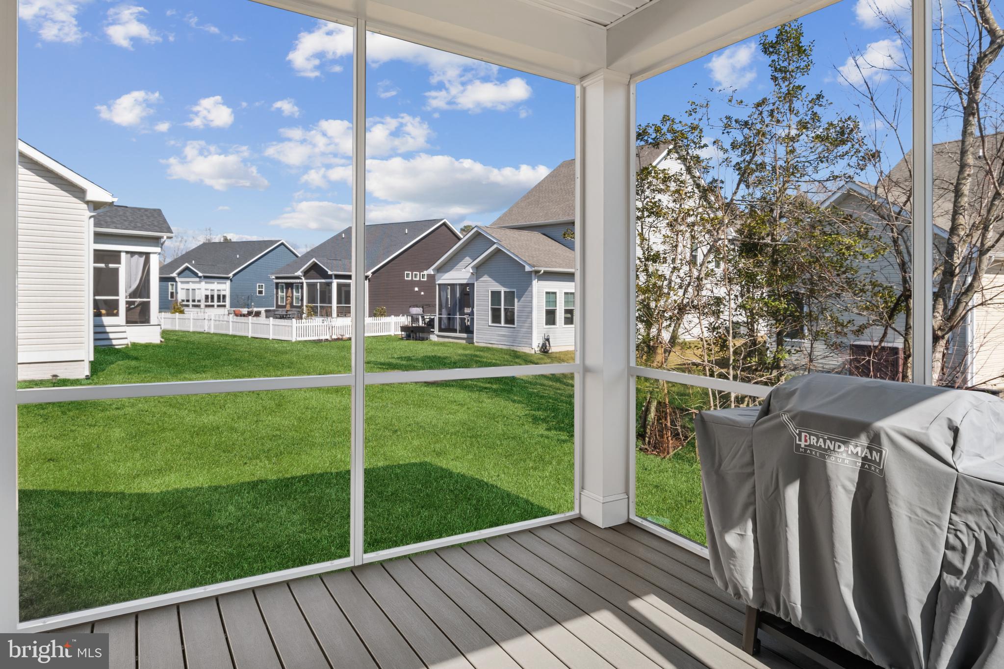 19437 Longfellow Way Georgetown, DE 19947 - Photo 33 of 33 a view of a house with a yard