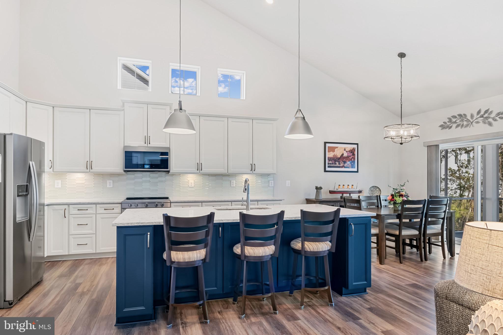 19437 Longfellow Way Georgetown, DE 19947 - Photo 4 of 33 a view of kitchen with cabinets and wooden floor