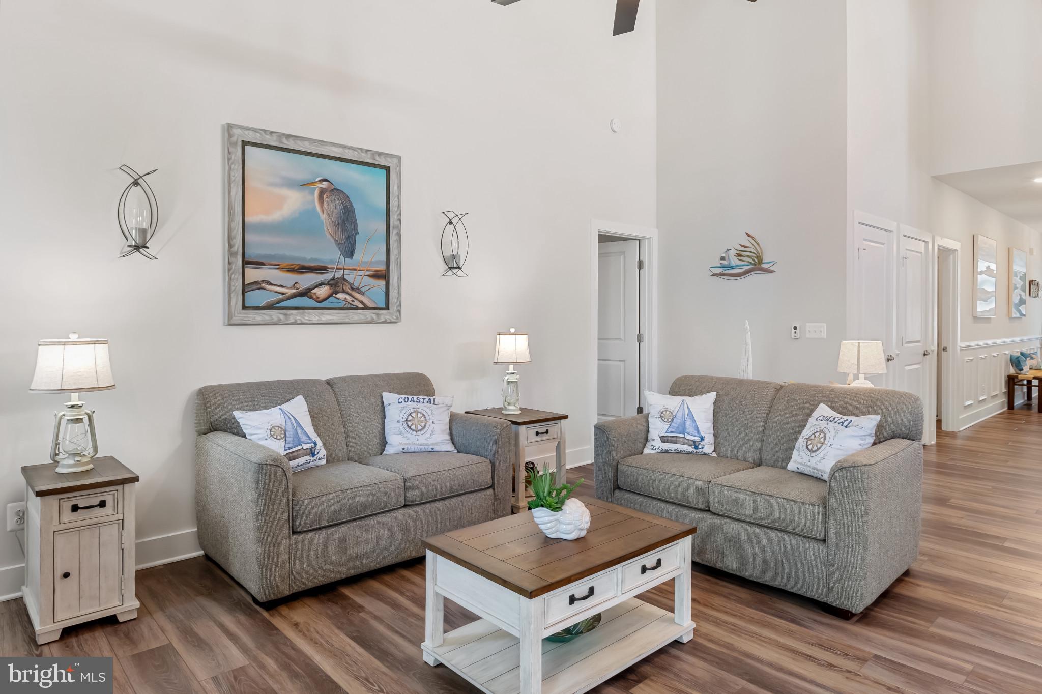 19437 Longfellow Way Georgetown, DE 19947 - Photo 6 of 33 a living room with furniture and wooden floor