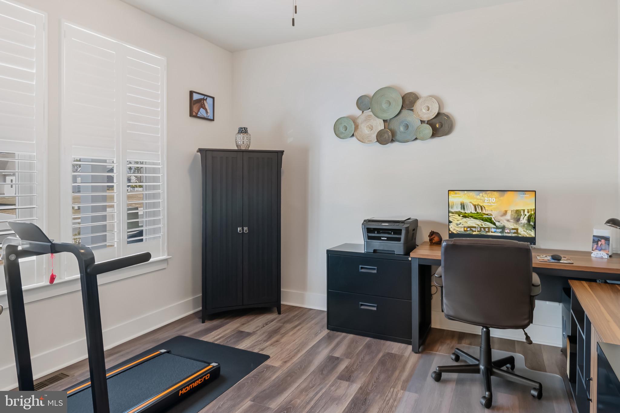 19437 Longfellow Way Georgetown, DE 19947 - Photo 9 of 33 a workspace with furniture and window