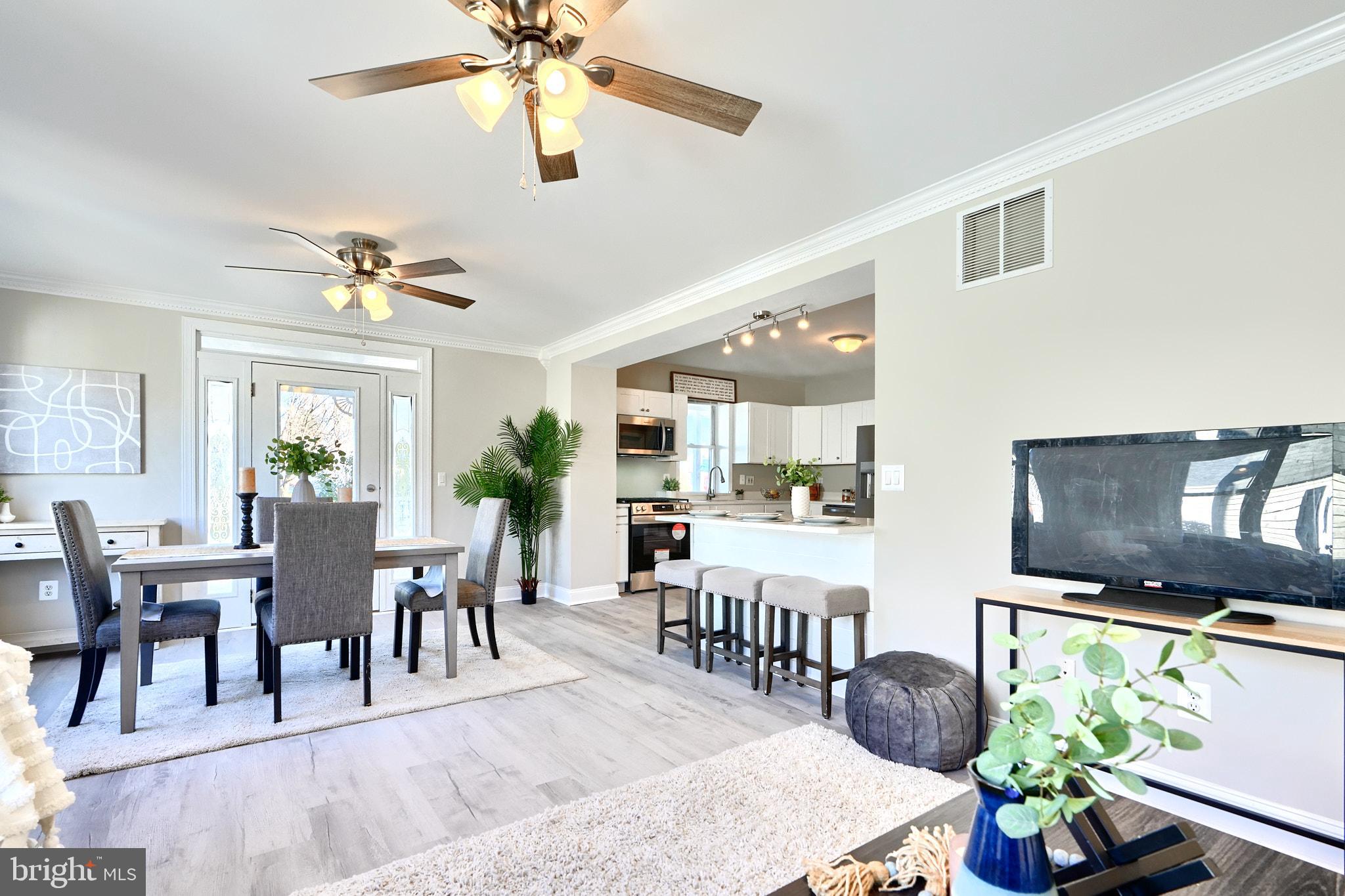 235 Pinewood Road Dundalk, MD 21222 - Photo 25 of 59 a view of a dining room with furniture window and wooden floor