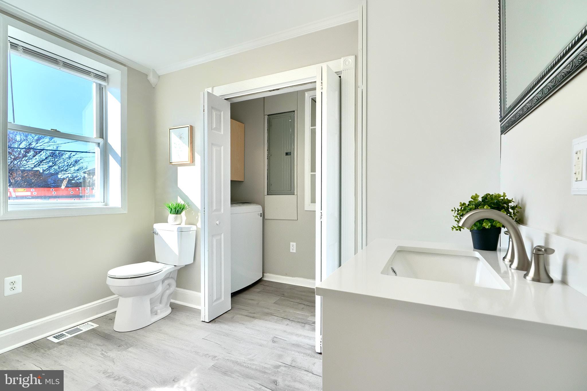 235 Pinewood Road Dundalk, MD 21222 - Photo 26 of 59 a bath room with a toilet and a bathtub