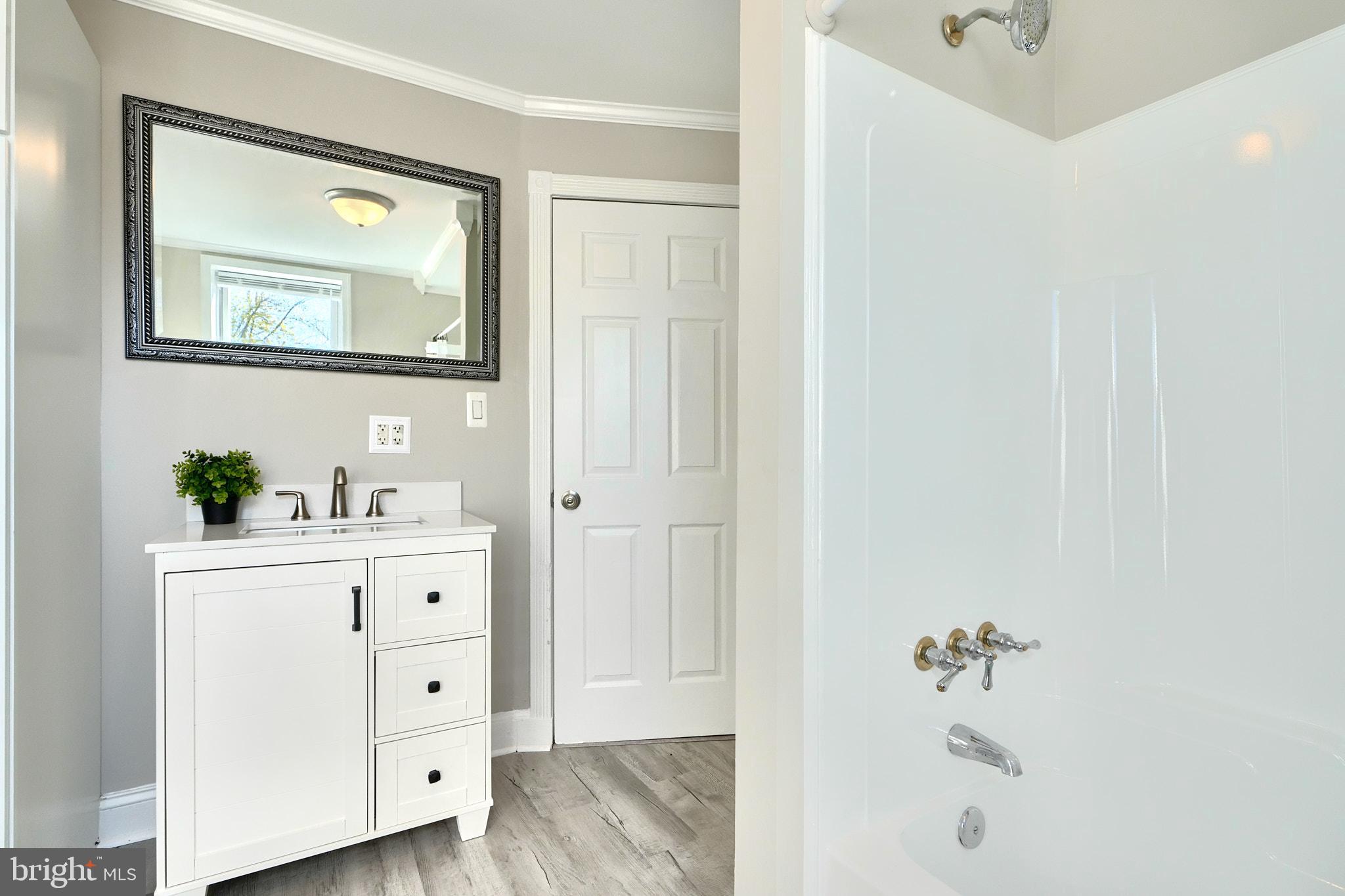 235 Pinewood Road Dundalk, MD 21222 - Photo 27 of 59 a bathroom with a bathtub and a sink