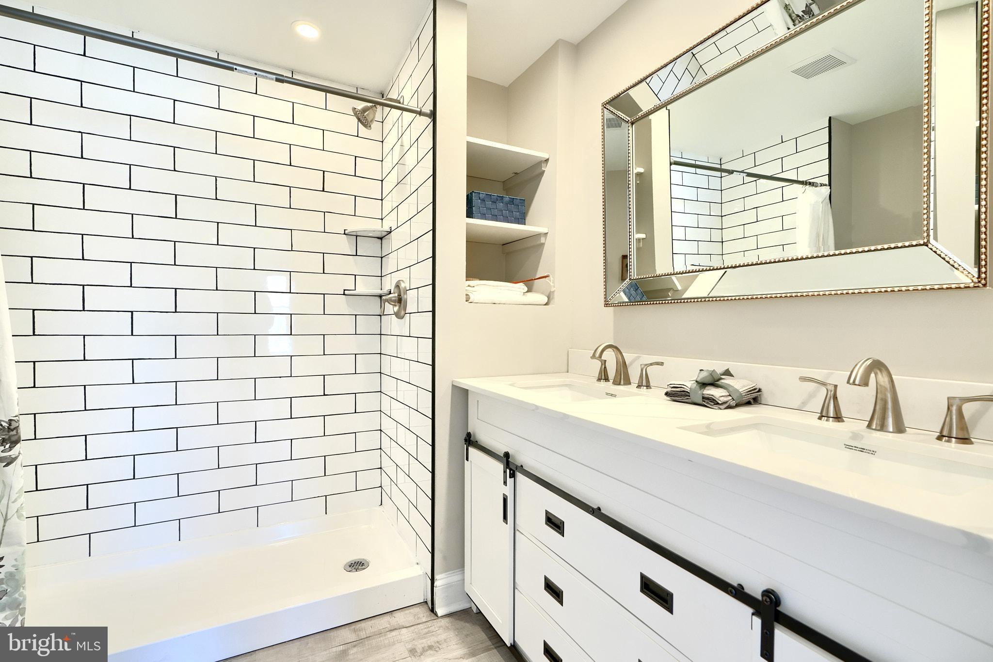 235 Pinewood Road Dundalk, MD 21222 - Photo 36 of 59 a bathroom with a sink and a mirror