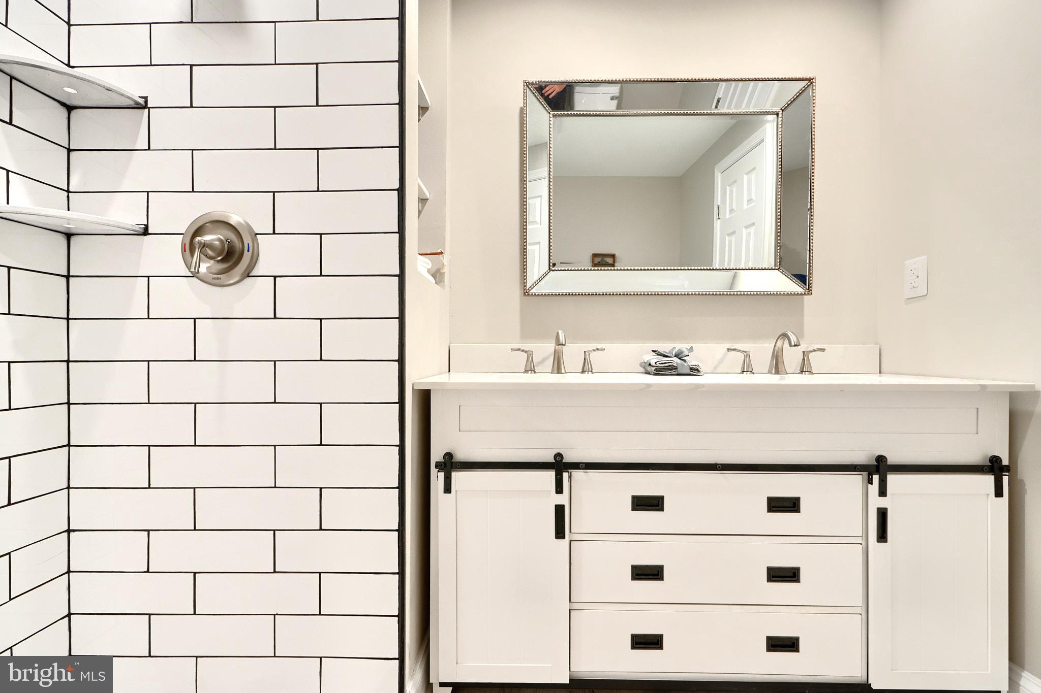 235 Pinewood Road Dundalk, MD 21222 - Photo 38 of 59 a bathroom with a sink vanity and a mirror