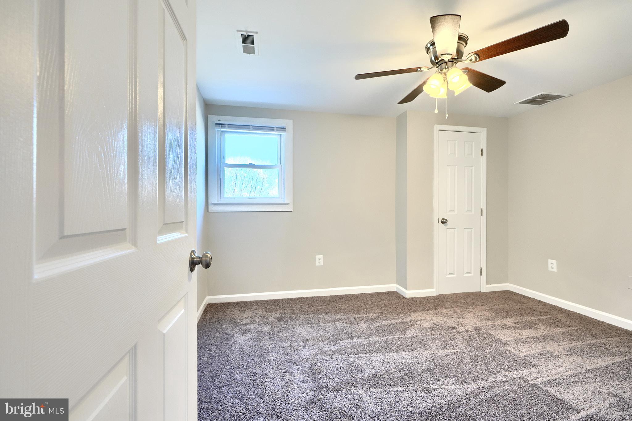 235 Pinewood Road Dundalk, MD 21222 - Photo 44 of 59 a view of a livingroom with a ceiling fan and window