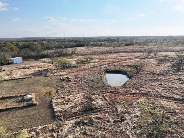 a view of a street with a yard