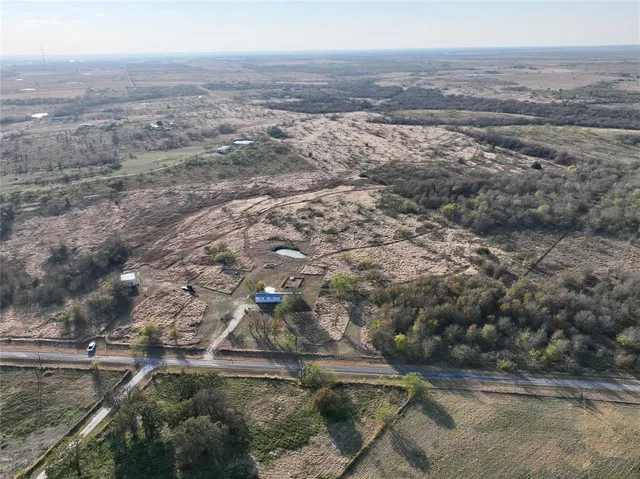 a kitchen with granite countertop a stove and a refrigerator