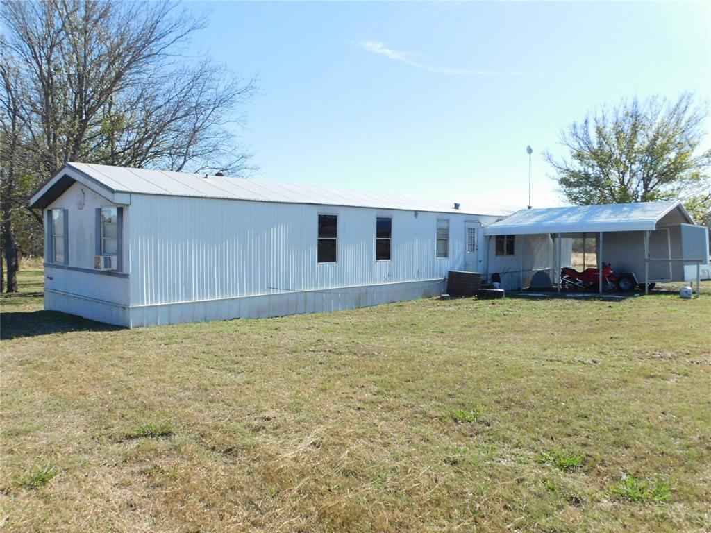 233 HCR 3315 Hubbard, TX 76648 - Photo 30 of 31 a front view of a house with a yard and garage