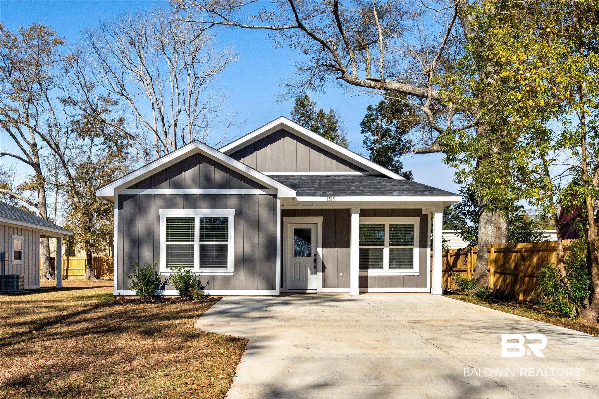 18151 Hoiles Street Robertsdale, AL 36567 - Photo 1 of 23 View of front facade featuring a front lawn
