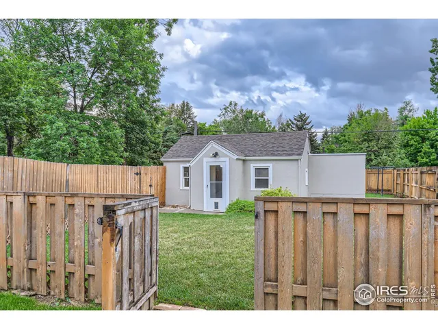 a aerial view of a house with a yard and a garden