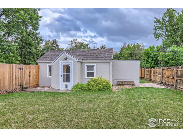 a view of a backyard with a garden