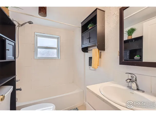 a view of a backyard with wooden fence