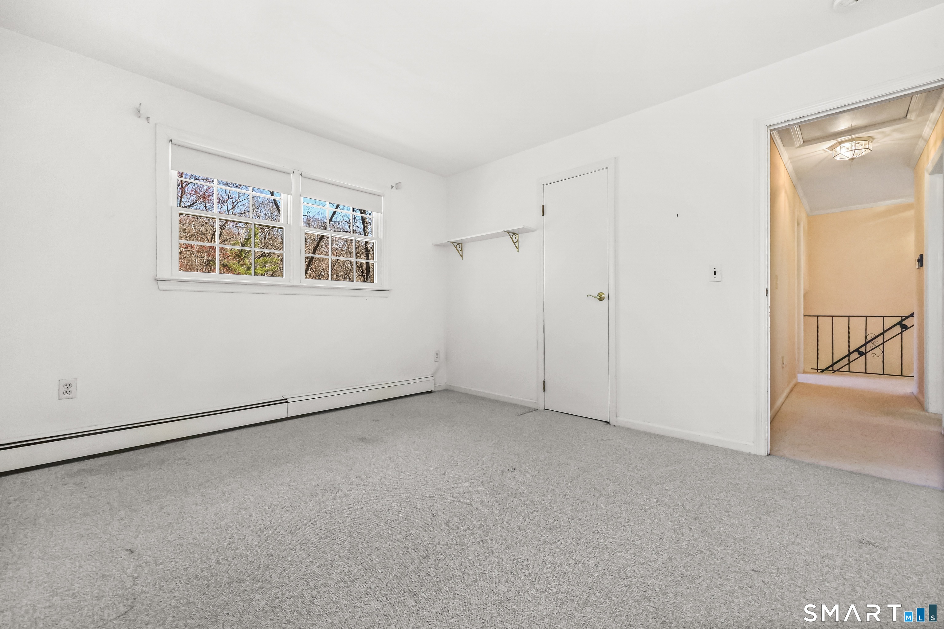 145 Wilton Road East Ridgefield, CT 06877 - Photo 13 of 35 Living room again with hardwood floors under the carpet