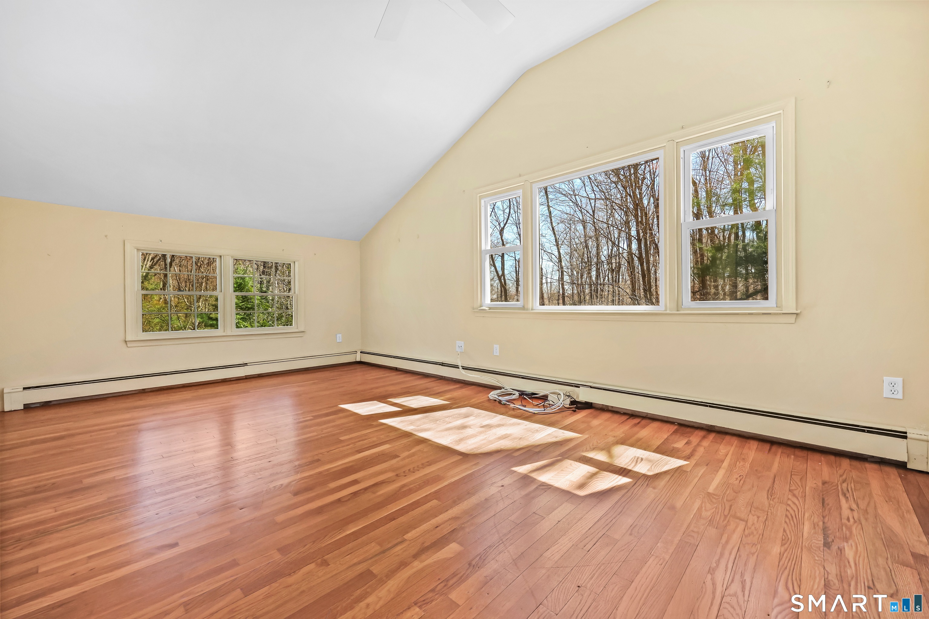 145 Wilton Road East Ridgefield, CT 06877 - Photo 18 of 35 Primary bedroom with vaulted ceilings.