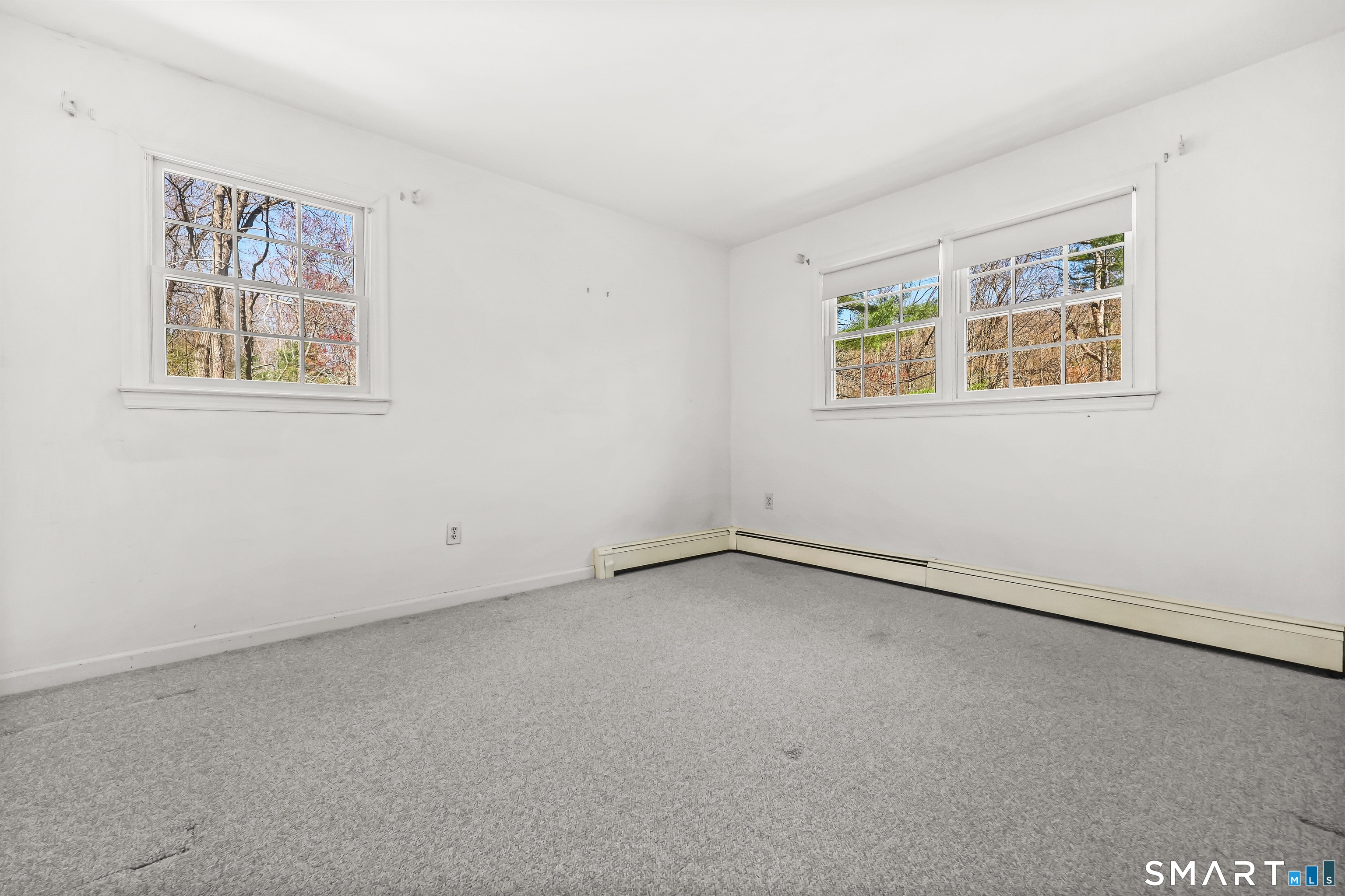 145 Wilton Road East Ridgefield, CT 06877 - Photo 22 of 35 Another family bedroom, all with hardwood under the carpet.
