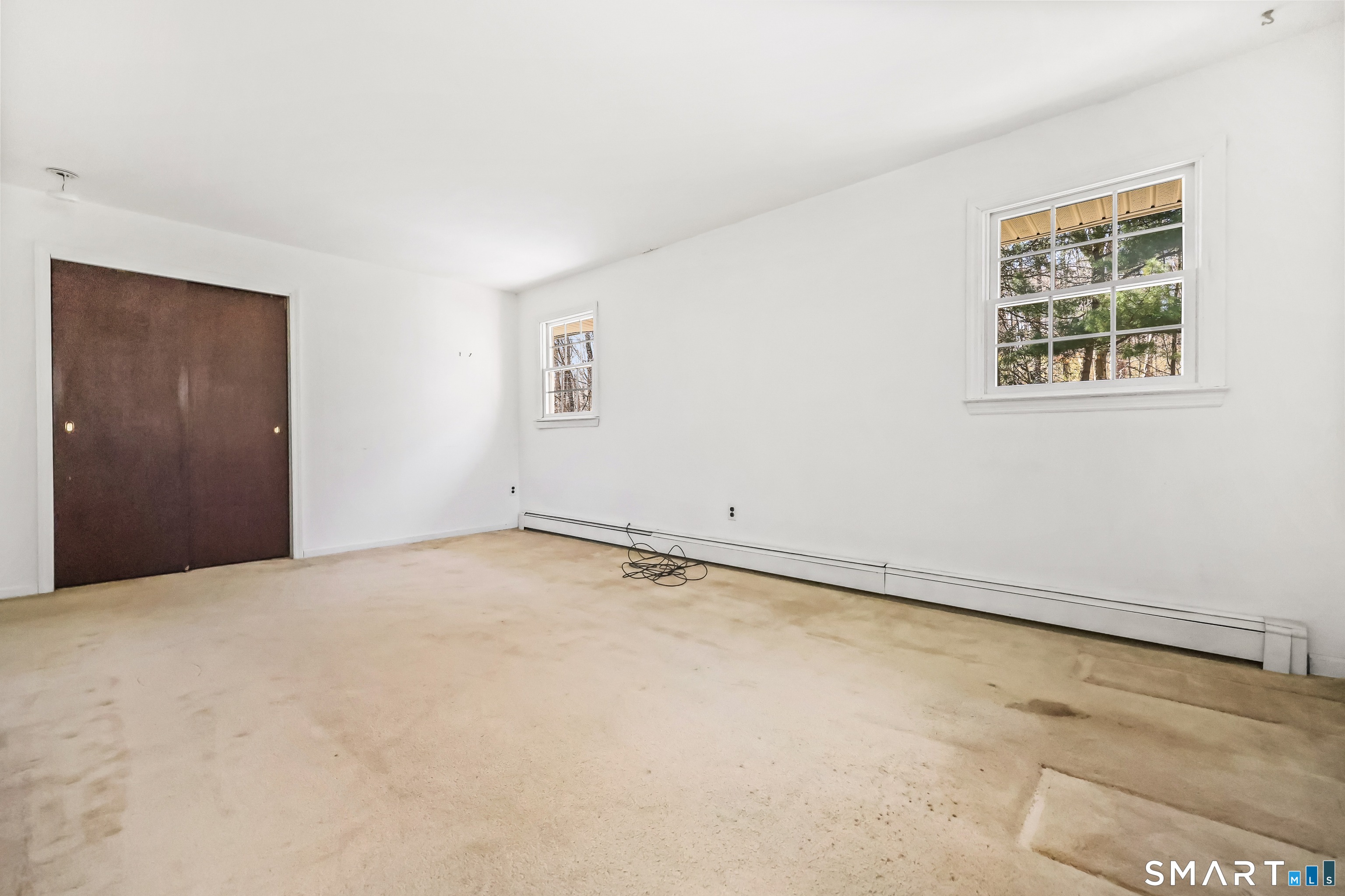 145 Wilton Road East Ridgefield, CT 06877 - Photo 26 of 35 4th Bedroom with hardwood floors under the carpeting.