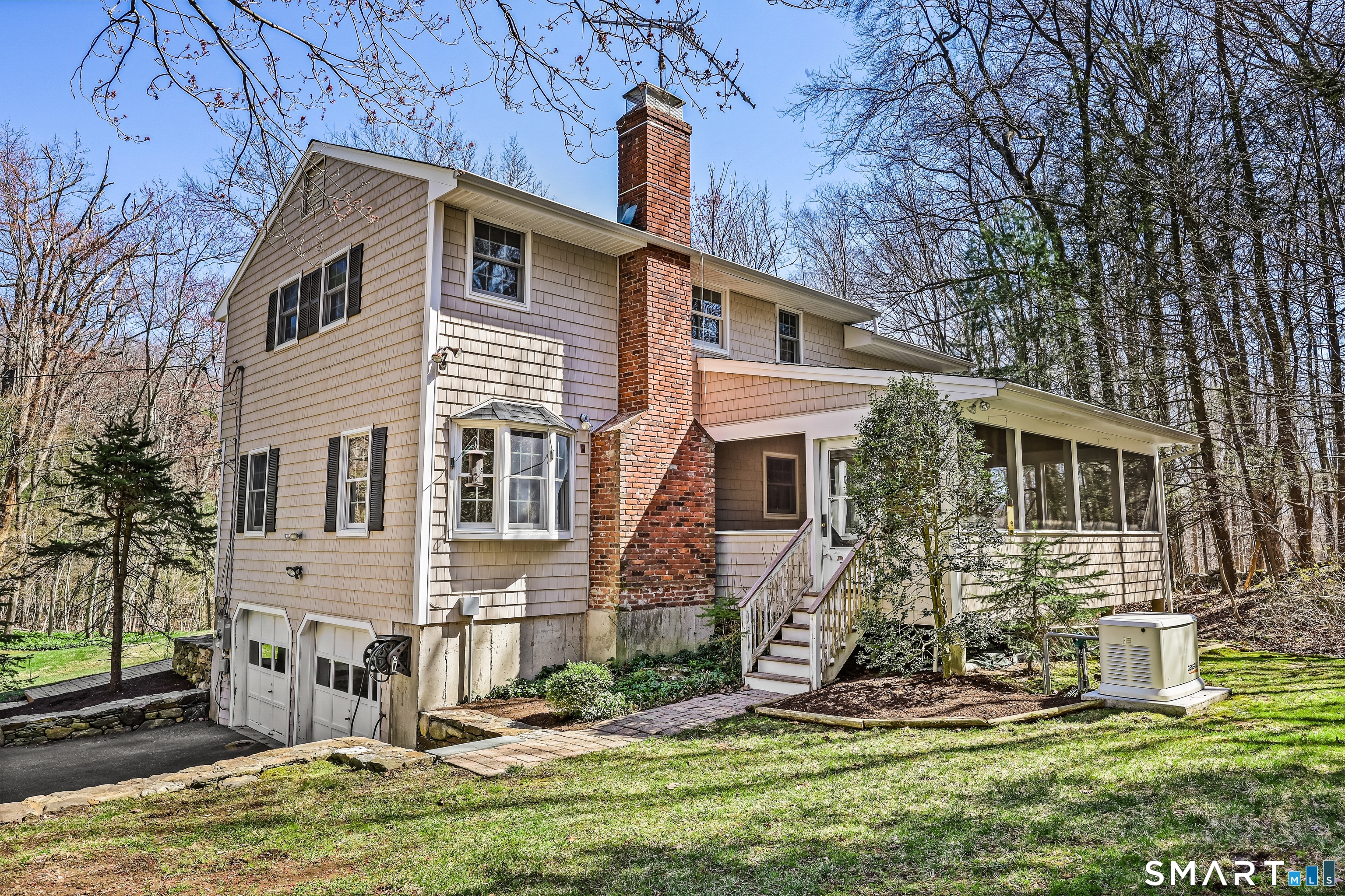 145 Wilton Road East Ridgefield, CT 06877 - Photo 4 of 35 Rear of home with sunporch and generator!