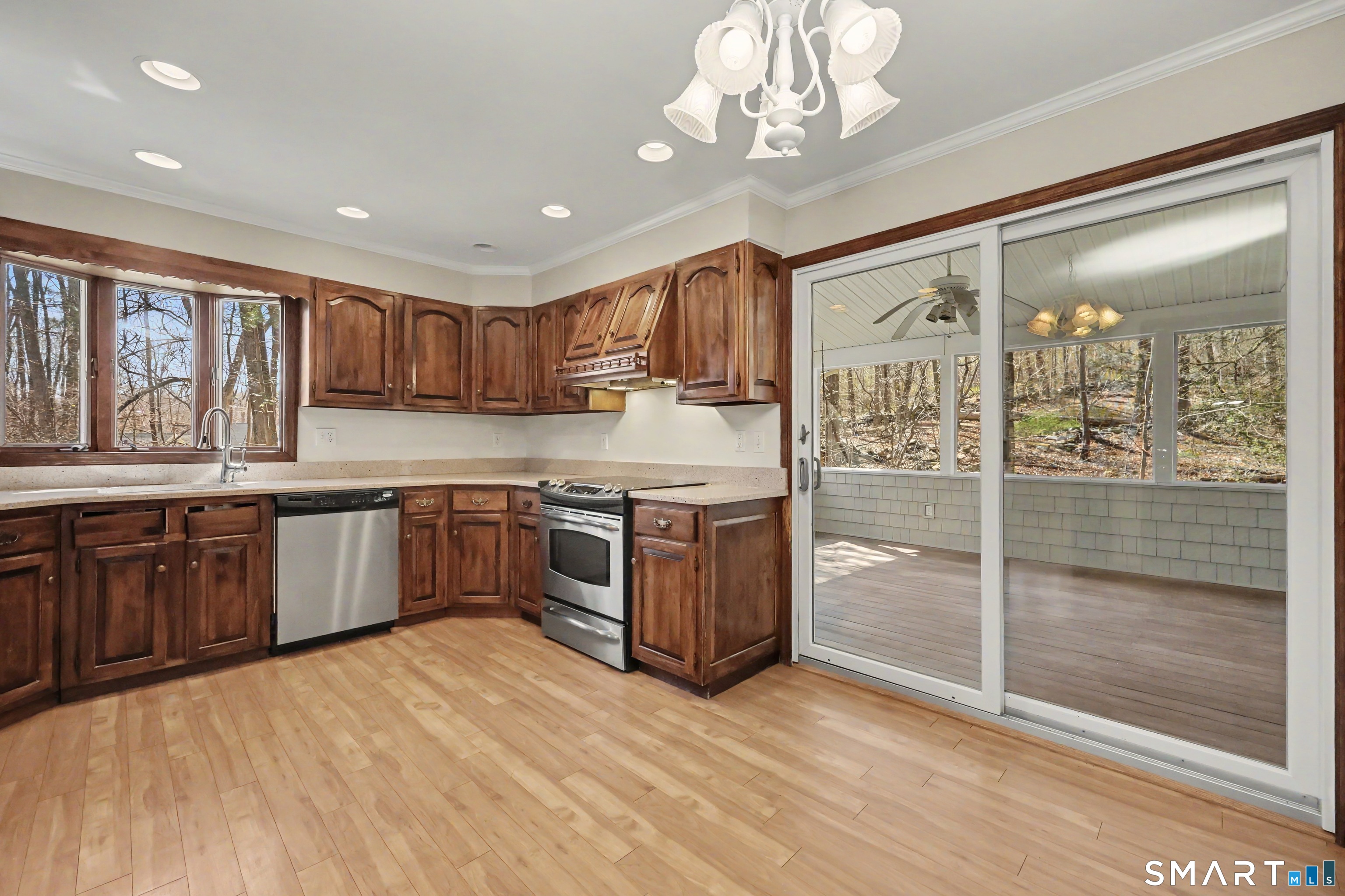 145 Wilton Road East Ridgefield, CT 06877 - Photo 8 of 35 Kitchen leading out to the oversized, screened in pporch.
