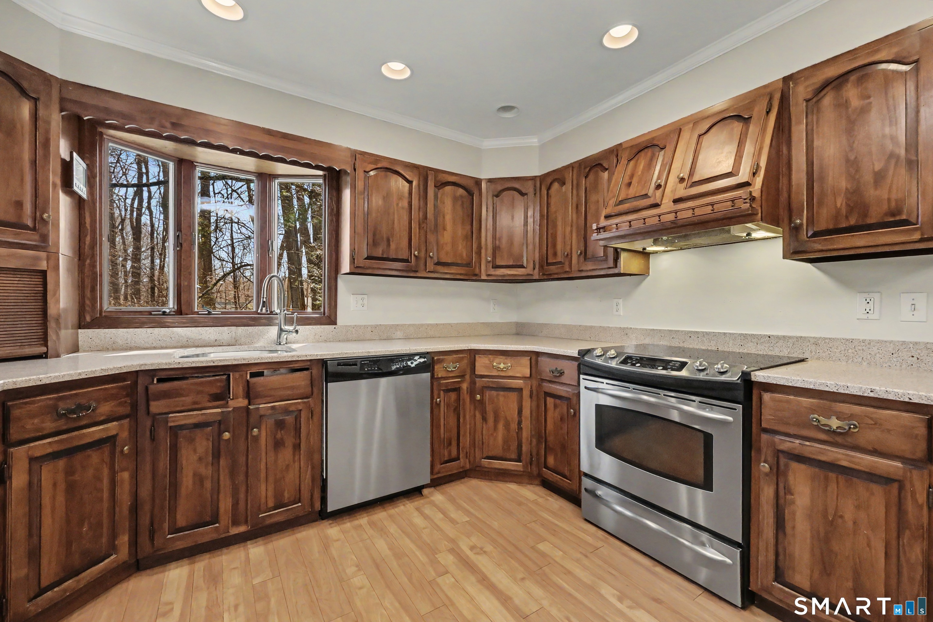 145 Wilton Road East Ridgefield, CT 06877 - Photo 9 of 35 Beautiful views from the kitchen which leads to the porch, family room and dining room.