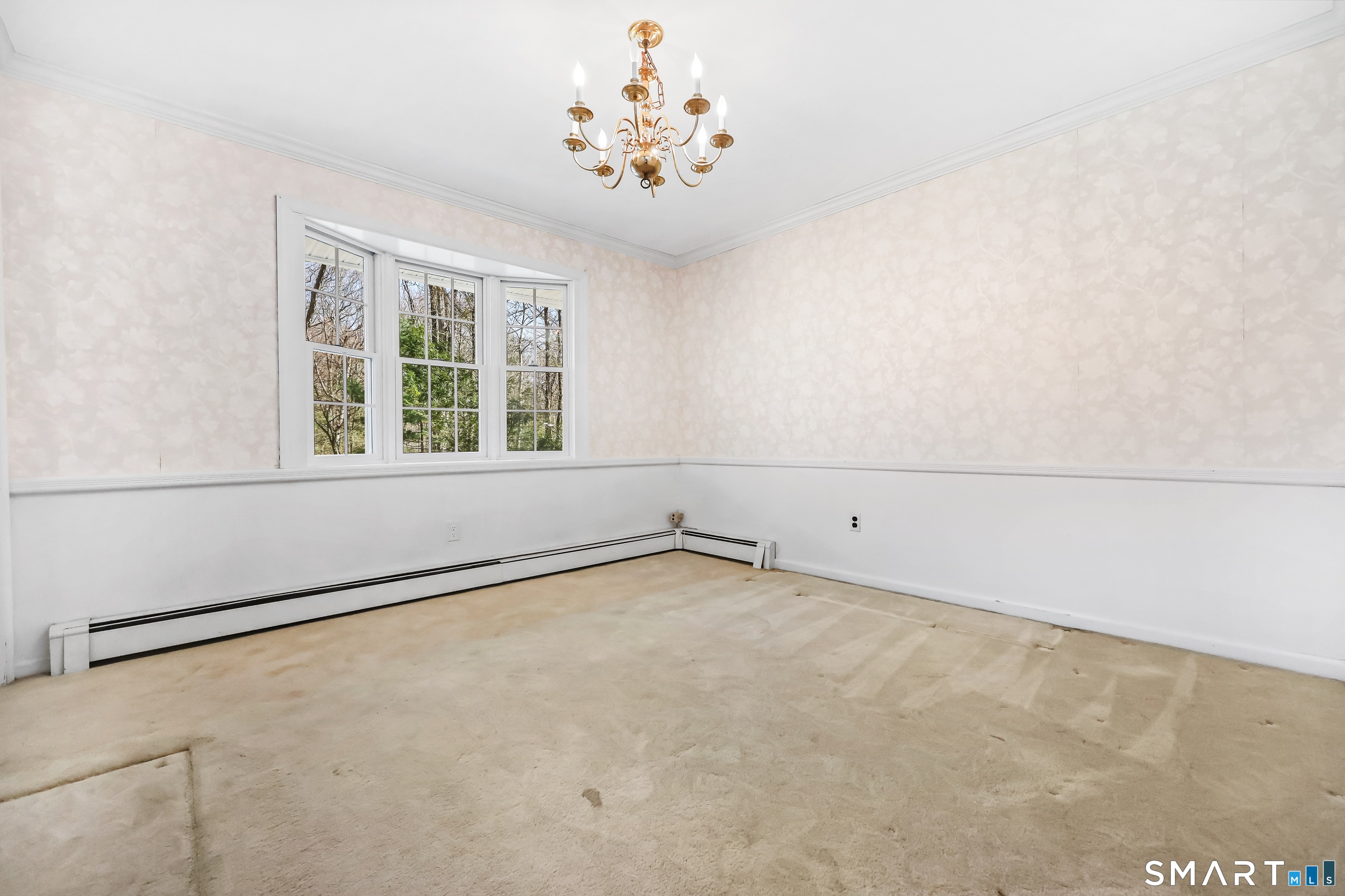 145 Wilton Road East Ridgefield, CT 06877 - Photo 10 of 35 Dining room with hardwood floors under the carpet.