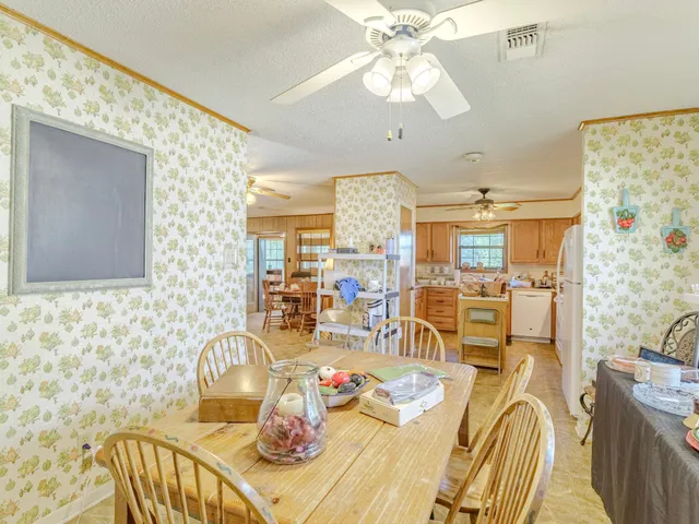 a spacious bedroom with bed and a couch