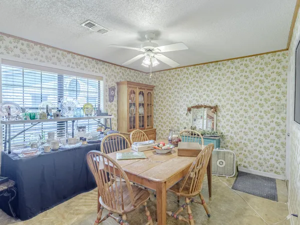 a view of a dining room with furniture window and outside view