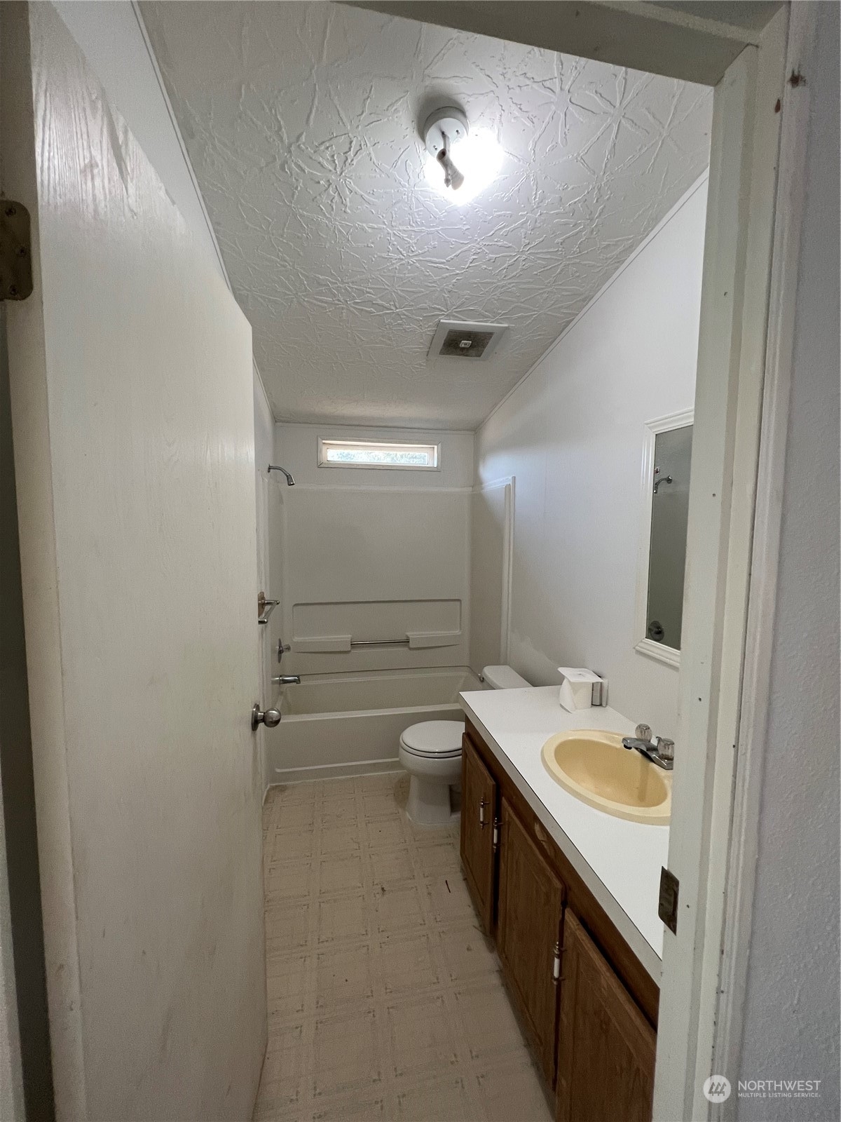 226 Limmer Road Winlock, WA 98596 - Photo 17 of 32 a bathroom with a sink a toilet and a mirror