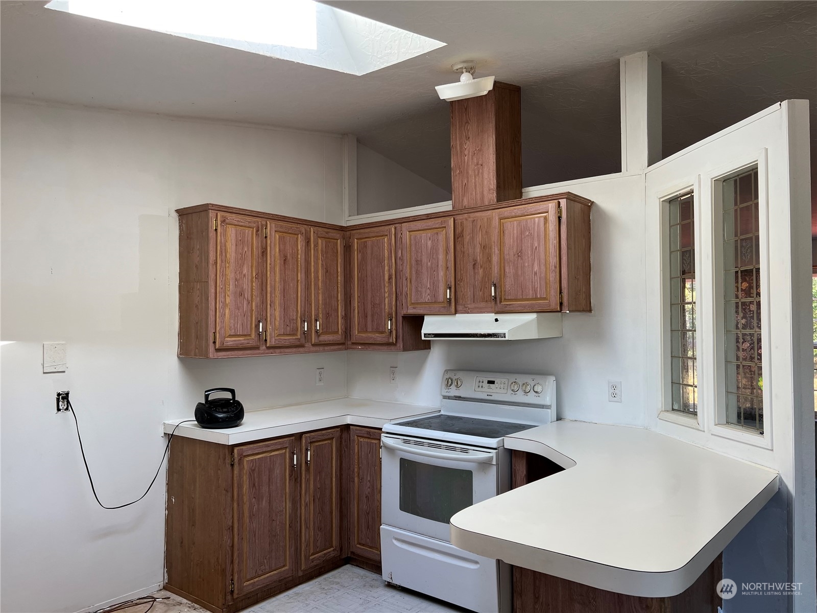 226 Limmer Road Winlock, WA 98596 - Photo 8 of 32 a kitchen with stainless steel appliances a stove a sink a refrigerator and cabinets