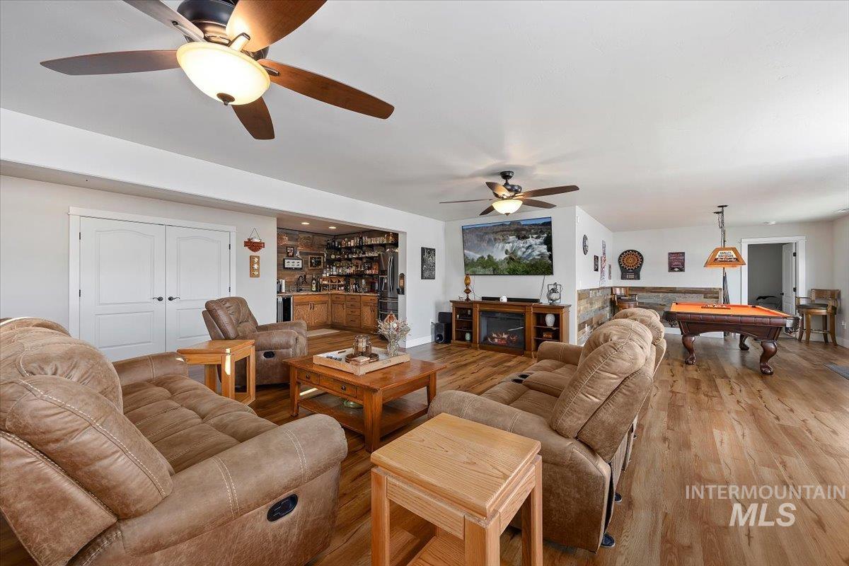 40 Bell Rapids Road Hagerman, ID 83332 - Photo 14 of 50 Living area featuring billiards, a ceiling fan, and wood finished floors