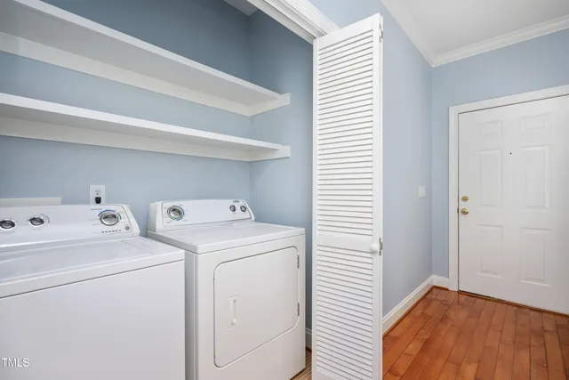 a view of storage and utility room with washer and dryer