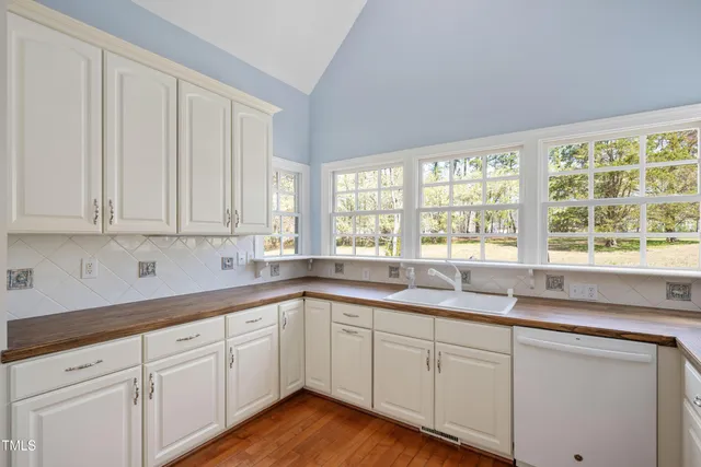 a kitchen with sink and cabinets